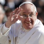 Pope Francis waves to crowds as he arrives to his inauguration mass on 19 March 2013.